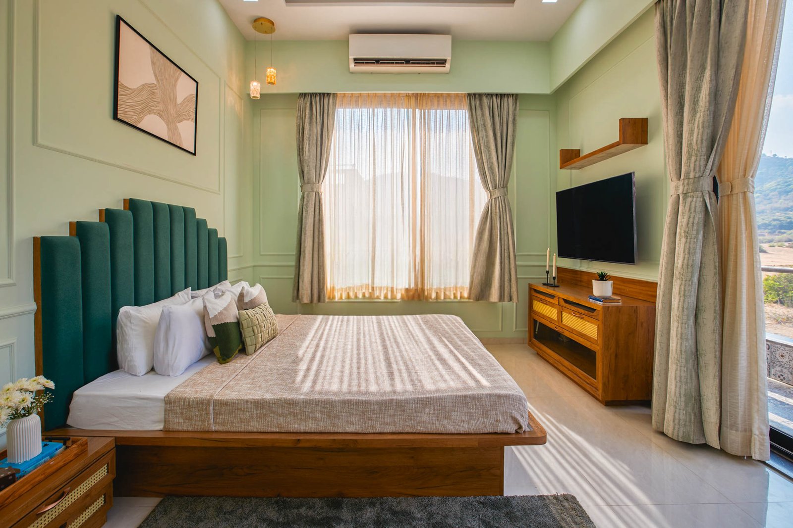 MASTER BEDROOM – Bed dressed, hill view through full window, soft morning light.